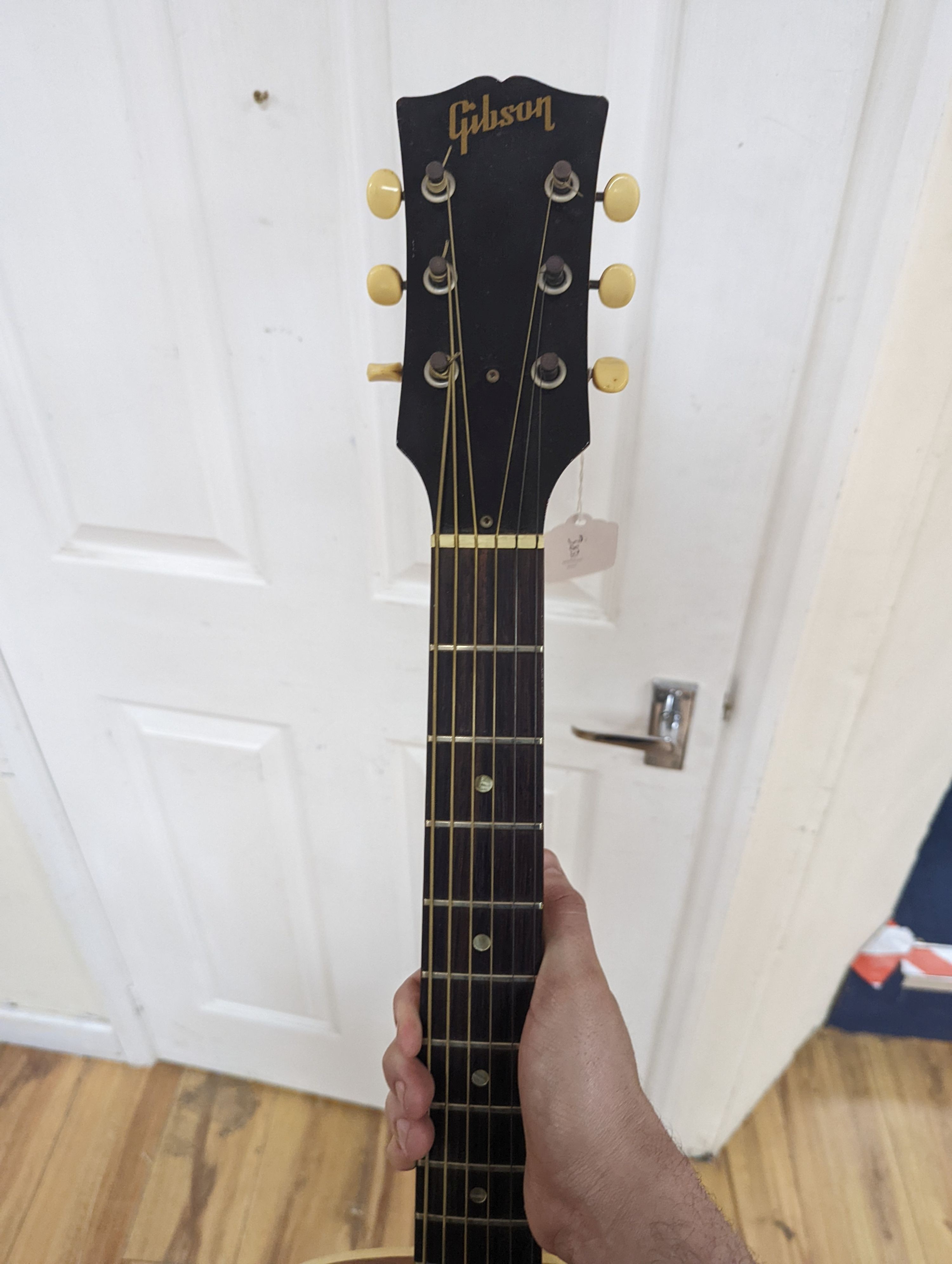 A Gibson acoustic guitar in hard case, serial no. 430 862